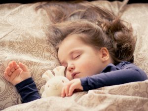 Do you struggle with getting your kids to sleep at night? Here are some tips and tricks to make bedtime easier for everyone.